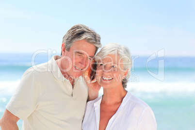 Retired couple listening to their shell