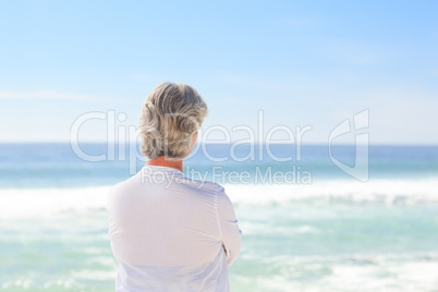 Happy retired woman on the beach Happy retired woman on the beach