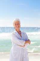 Happy retired woman on the beach