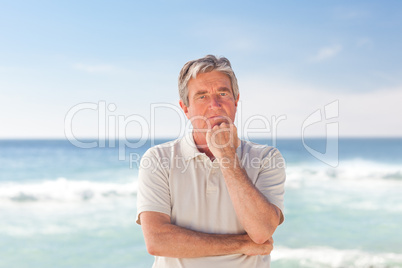 Pensif man on the beach