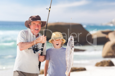 Man fishing with his grandson