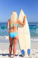 Lovely woman with her surfboard