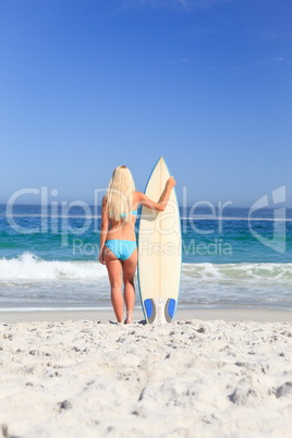 Lovely woman with her surfboard
