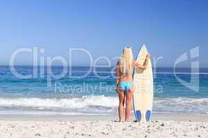 Lovely woman with her surfboard