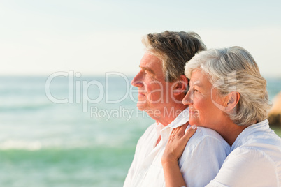 Woman hugging her husband at the beach