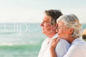 Woman hugging her husband at the beach