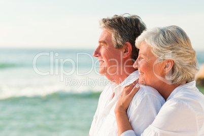 Woman hugging her husband at the beach