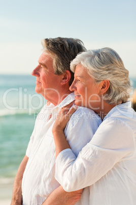 Woman hugging her husband at the beach