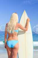 Lovely woman with her surfboard