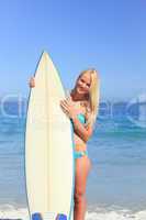 Lovely woman with her surfboard