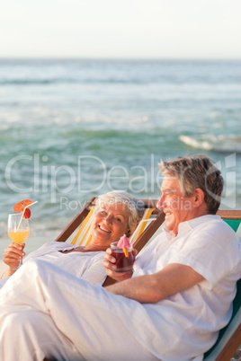 Retired couple drinking a cocktail