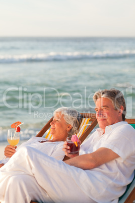 Retired couple drinking a cocktail