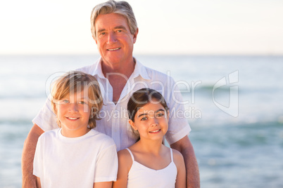 Portrait of a Grandfather with their grandchildren