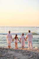 Portrait of a family beside the sea