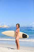 Lovely woman with her surfboard