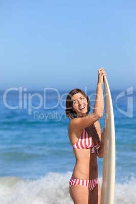 Lovely woman with her surfboard