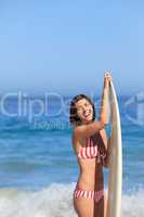 Lovely woman with her surfboard