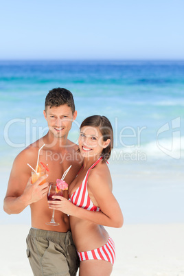 Adorable couple drinking a cocktail