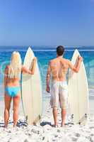 Couple with their surfboards