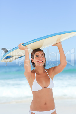 Pretty woman with her surfboard