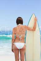 Pretty woman with her surfboard