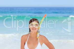 Woman with her mask at the beach