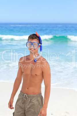 Man with his mask at the beach