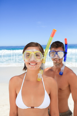 Couple with their mask at the beach