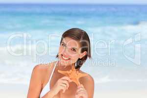 Lovely woman with a starfish