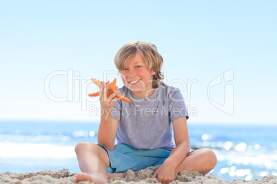 Little boy with a starfish