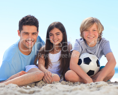 Father and his children with a ball