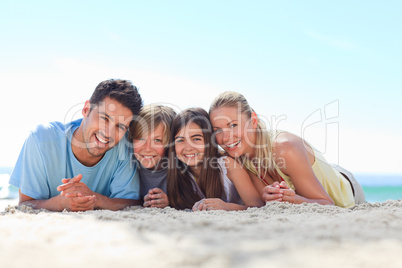 Children with their parents at the beach