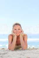 A woman sunbathing at the beach