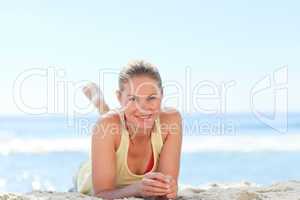 Lovely woman sunbathing at the beach