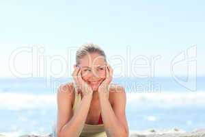 Lovely woman sunbathing at the beach