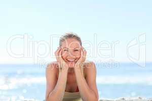 Lovely woman sunbathing at the beach