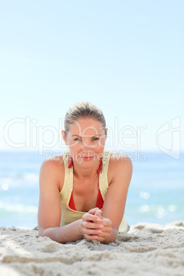 Lovely woman sunbathing at the beach