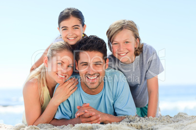 Portrait of a smiling famiy at the beach