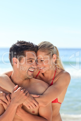 Happy lovers at the beach