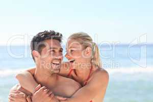 Joyful couple at the beach