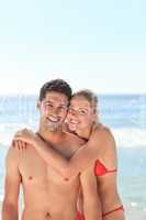 Joyful couple at the beach