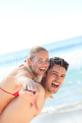 Beautiful man having girlfriend a piggyback