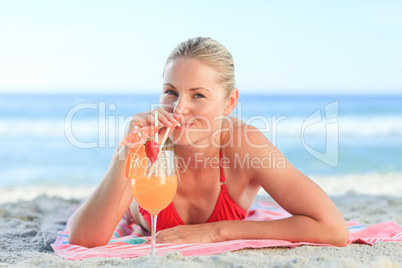 Cute woman drinking her cocktail