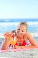 Cute woman drinking her cocktail