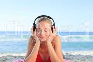 Radiant woman listening to some music