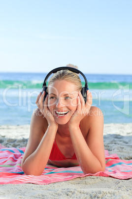 Radiant woman listening to some music