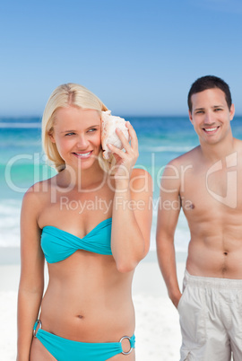 Couple listening to their shell