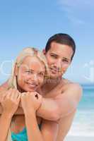 Enamored couple on the beach