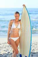 Sexy woman with her surfboard