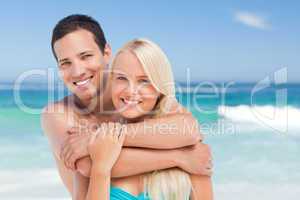 Enamored couple on the beach